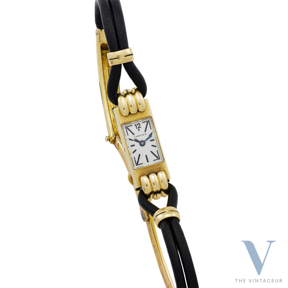 CARTIER DUOPLAN, FANCY 18K YELLOW GOLD CASE, EWCo 403 HAND-WOUND MOVEMENT, FROM THE 1930s.