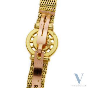 CARTIER "GOUVERNAIL", SKELETON 18KT YELLOW GOLD CASE, 18KT YELLOW GOLD BRACELET WITH 18KT ROSE GOLD "EJ" DEPLOYANT CLASP, HAND-WOUND MOVEMENT EWC. CO 462/2, FROM THE 1940s