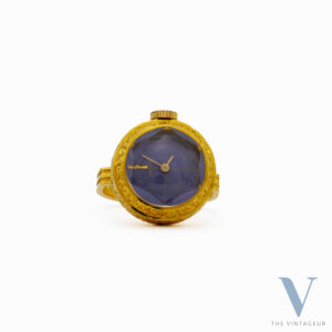 SEIKO RING WATCH REF. 17-0610, BLUE-PURPLE DIAL, FACETED DIAMOND-SHAPED CRYSTAL, 18KT YELLOW GOLD CASE, IN-HOUSE MANUAL WINDING MOVEMENT, FROM THE 1970s