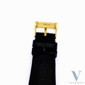 UNIVERSAL GENEVE "TRITON" REF. 10912, BLUE ENAMEL DIAL WITH EMBOSSED GOLD MINIATURE OF TRITON, SQUARE-SHAPED 18KT YELLOW GOLD CASE, HAND-WOUND UG 264 MOVEMENT, FROM THE 1940s