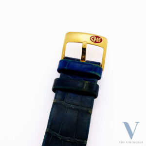 CORUM "ARC DE TRIOMPHE" REF. 24.374.65, BLUE GUILLOCHE DIAL, 18KT YELLOW GOLD CASE WITH DIAMONDS AND SAPPHIRES, ISA 125 QUARTZ MOVEMENT, FROM 1980