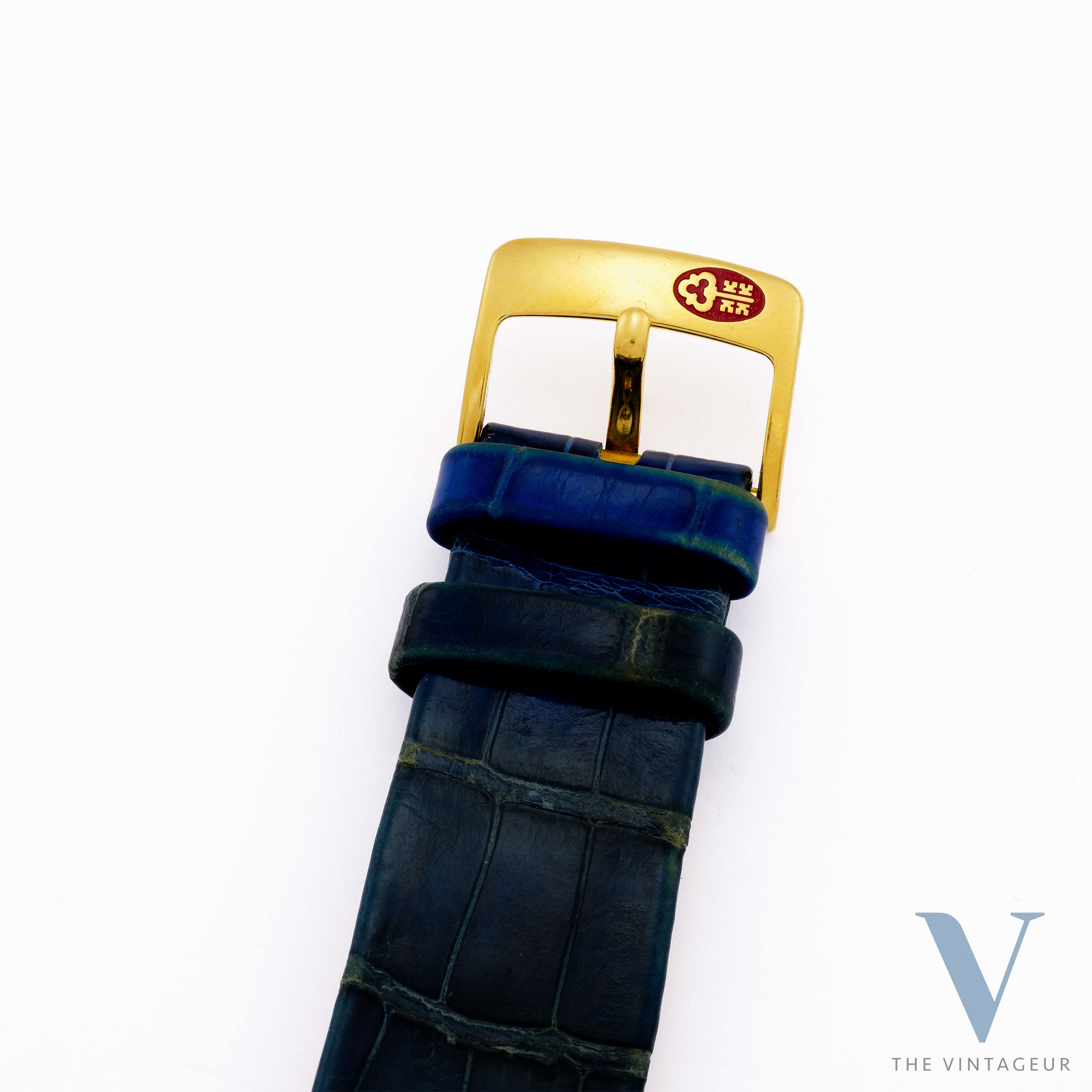CORUM "ARC DE TRIOMPHE" REF. 24.374.65, BLUE GUILLOCHE DIAL, 18KT YELLOW GOLD CASE WITH DIAMONDS AND SAPPHIRES, ISA 125 QUARTZ MOVEMENT, FROM 1980 CORUM "ARC DE TRIOMPHE" REF. 24.374.65, BLUE GUILLOCHE DIAL, 18KT YELLOW GOLD CASE WITH DIAMONDS AND SAPPHIRES, ISA 125 QUARTZ MOVEMENT, FROM 1980